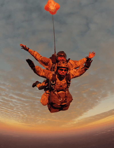 Heavy Load Tactical tandem skydive with drouge at sunset