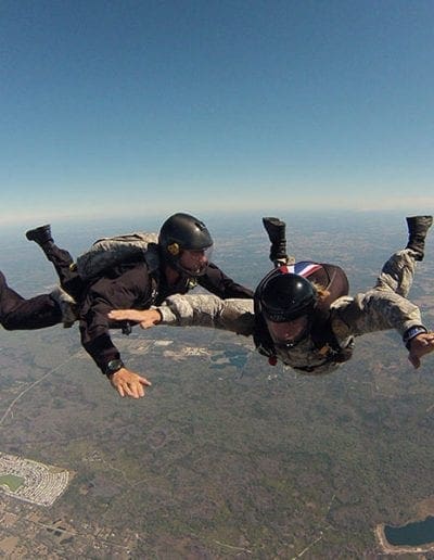 Instructor assisting student in freefall